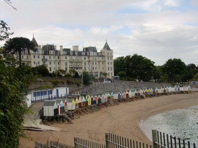 The Grand Hotel , fronted by beach huts.