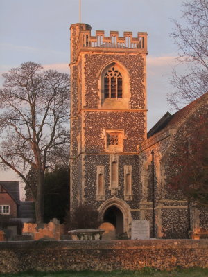 Early  sunlight  illuminates  the  church  tower,