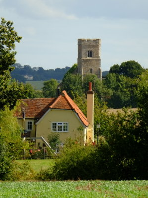 The  tower  of  St. Botolph's  church , dominates  the  skyline, behind  Slade's  Farm.