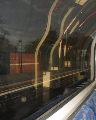 Reflections  in  a  tube  train  window.