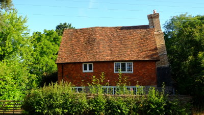 Cottage  with  a  curious  leaning  chimney.