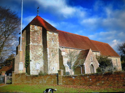 Beth the  collie  stands  before St. Marys  Church.