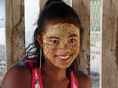 Young girl with sunscreen/moisturizer/beauty paste