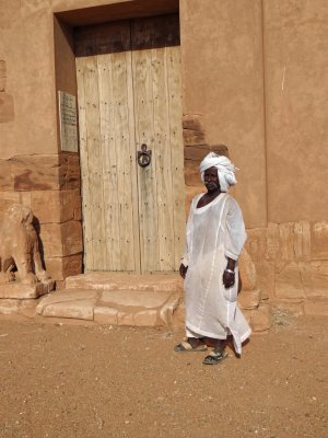 Temple caretaker (most traditional men are attired in long white robes, white skull caps with a white turban).
