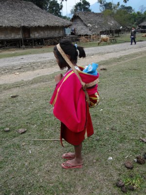 I thought this very young girl had a doll on her back; wrong, it was a tiny infant.