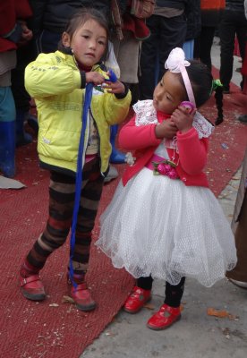Two little girls at the festival; everyone wants a cell phone, don't you think?