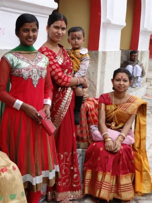 Nau Mata Bari Temple, Tripura; shrine is made of red terra cotta; hence the red dresses?