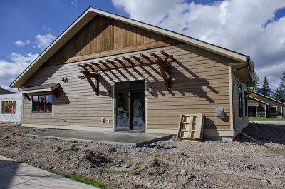 Back of house with new patio