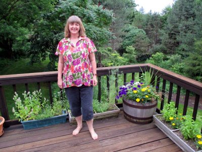 02 Tory with her deck garden (in new blouse).jpg