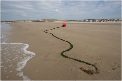 strand met de vakantiehuisjes