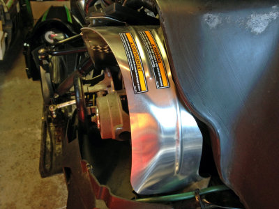 Modified clutch guard to clear fuel tank 