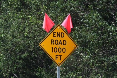  We Realize We Are Almost Gasless - Our Only Hope is Hope Down a Dead End 16 mile Road - This Sign Greets Us, But No Station