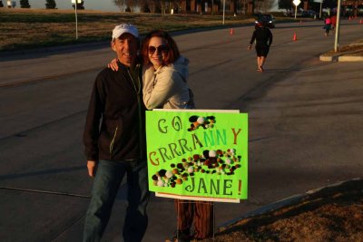 Uncle Marshall and Lyssa adjust a sign
