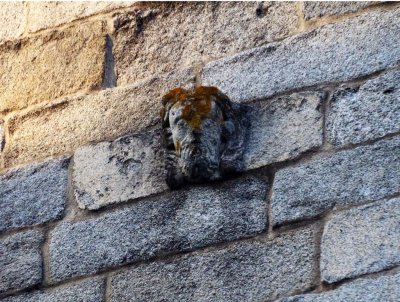 A Small Isolated Mask on an Exterior Wall is a Mystery