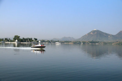 THE LAKE WITH THE SUMMER PALACE VISIBLE ON TOP OF THE MOUNTAIN