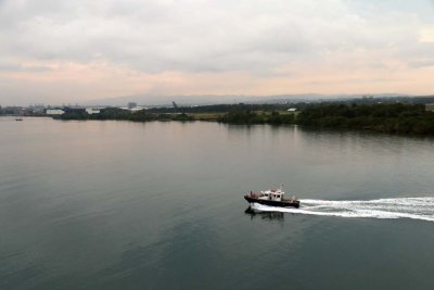 EARLY MORNING APPROACH TO THE GATUN LOCKS ON THE CARIBBEAN END OF THE CANAL