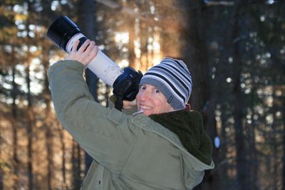 MB photographing a male Spruce Grouse at sunrise.