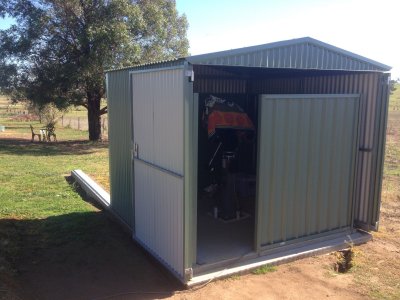 Doors open and folded back against side of observatory.