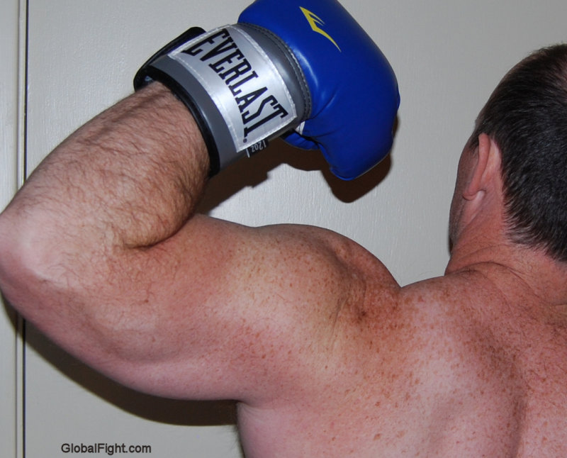 boxer man flexing big hairy arm.JPG