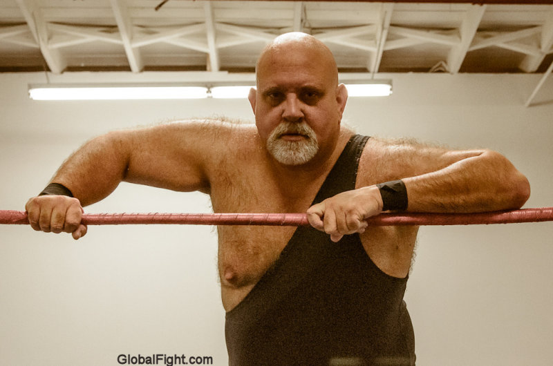 bald beefy bear man wearing one piece singlet.jpg