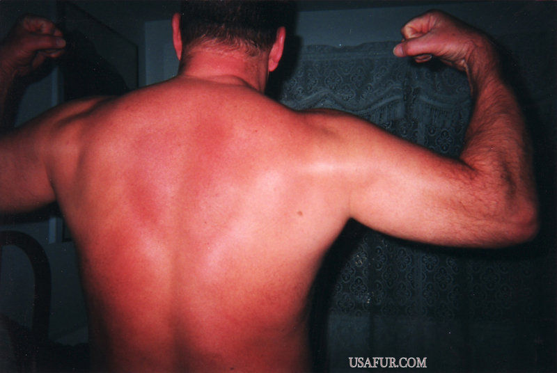 sunburned daddy flexing.jpg