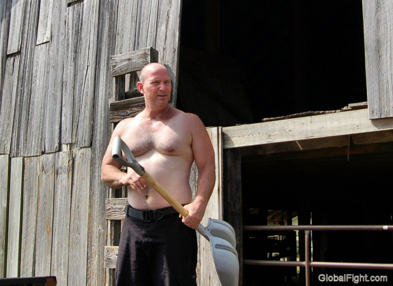 hairy cattle rancher shoveling.jpg