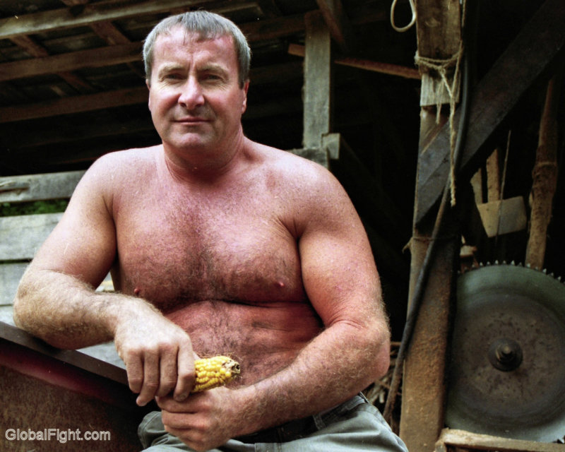 shirtless farmer working sawmill.jpg