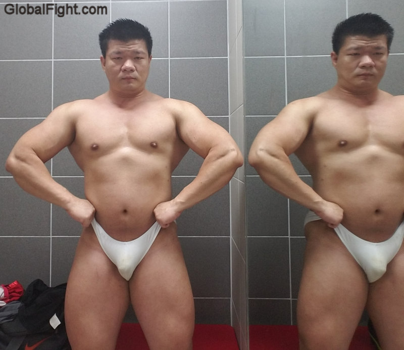bodybuilder speedos flexing.jpg