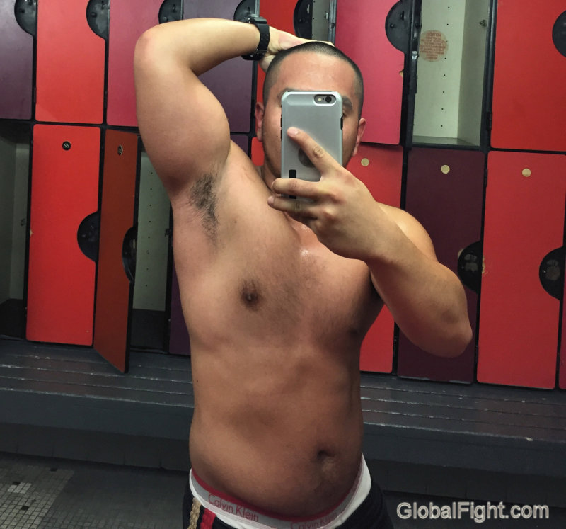 hot dude flexing gym.jpg