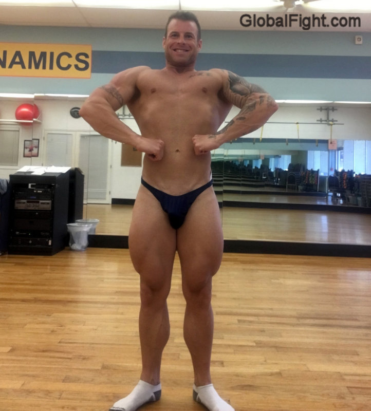 sexy bodybuilder flexing speedos.jpg