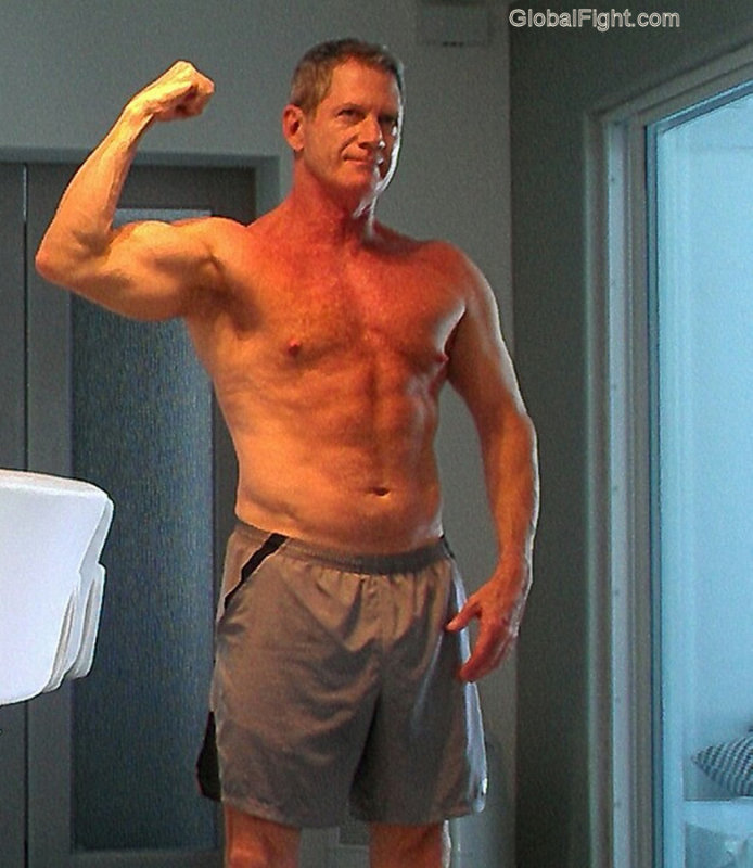sexy older man flexing.jpg