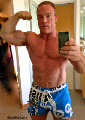 big stocky irish bloke flexing biceps.jpg