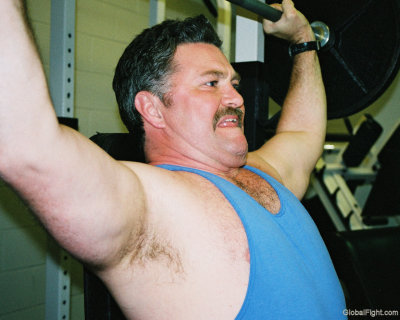handsome moustache man lifting weights.jpg