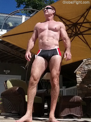 muscleman standing pool outside.jpg