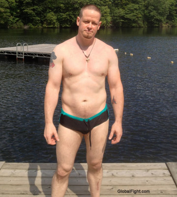 muscular hunky brother standing dock lakehouse.jpg