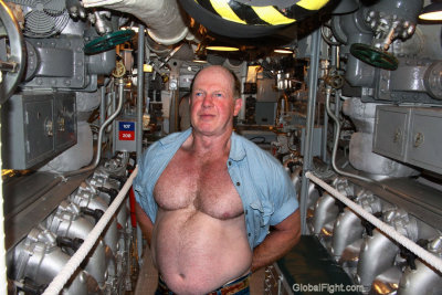 navy man removing shirt submarine.jpg