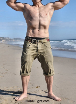 beach guy flexing his muscles.jpg