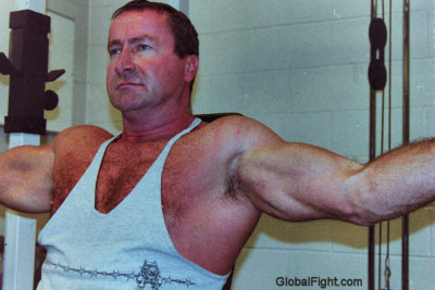 cop flexing big biceps.jpg