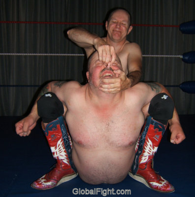 torturing his wrestling victim.jpg
