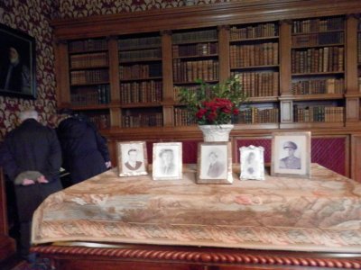 Lyme Park library, with photos of cast members from The Village 