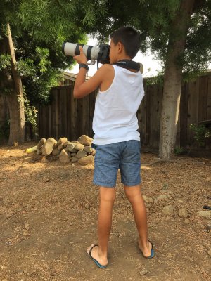The budding wildlife photographer. Heavy camera and lens combo but he did well with it.