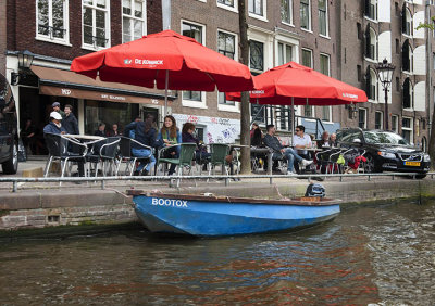 Red umbrellas at the canal