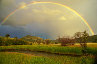 rainbow over mountain valley web.jpg