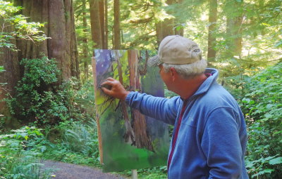 Painter in the woods