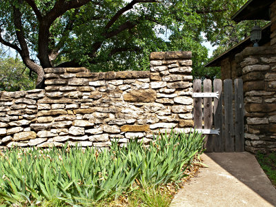 Rock fence and gate with hinges built by CCC