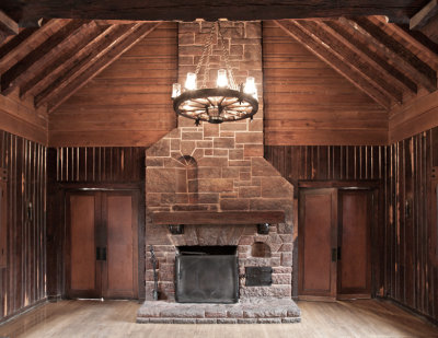 Main hall north fireplace with doorway leading to antiroom.