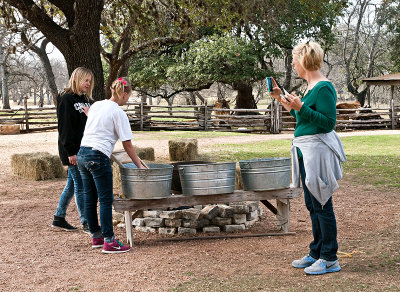 Mom photographing daughters