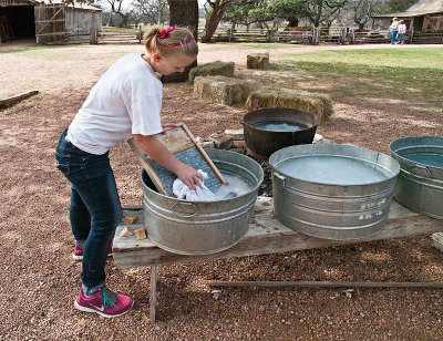 Daughter using scrubboard