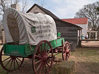 Covered wagon with sign