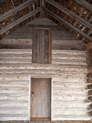 Wall and ceiling with door to sleeping loft